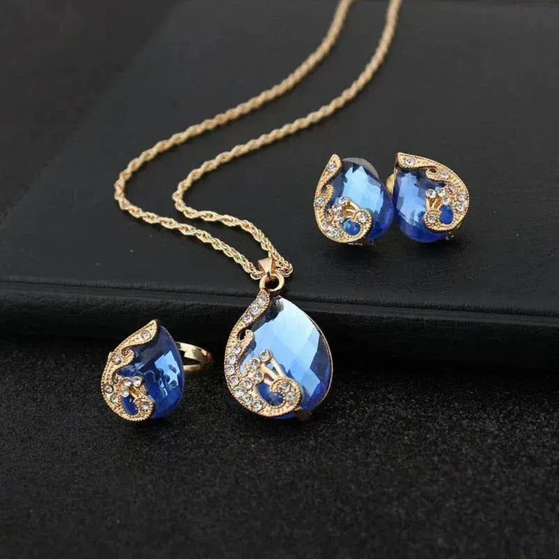 Conjunto de Collar y Pendientes de Cristal Azul en Oro